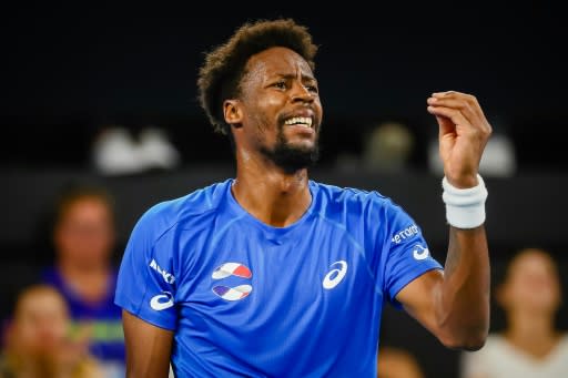 Gael Monfils reacts after a point against Serbia's Novak Djokovic during their men's singles match on day four of the ATP Cup tennis tournament in Brisbane