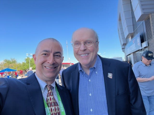 Doug Tammaro and College Football Playoff Executive Director Bill Hancock pose for a photo outside of State Farm Stadium in Glendale, Ariz. during the 2024 Final Four. (Photo Courtesy: Doug Tammaro)