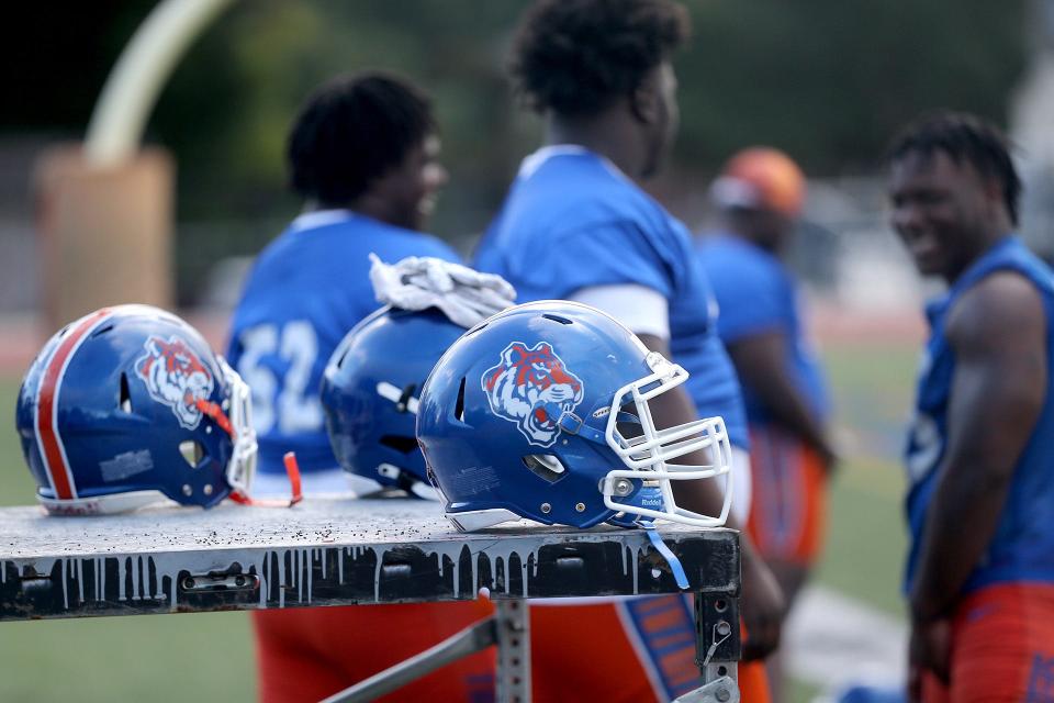 Players helmets sit off to the side as players get ready for practice at Savannah State University.