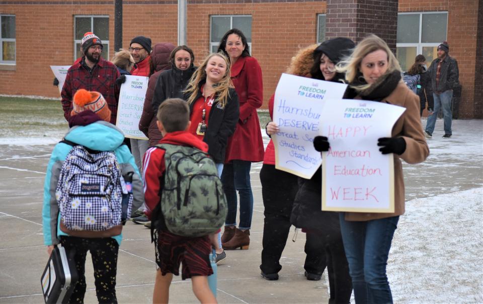 Teachers at North Middle School in Harrisburg stand in the cold as part of a "walk-in" to school to stand against the proposed social studies standards on Wednesday morning, Nov. 16, 2022.