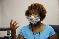 Social worker Chinnika Crisler speaks Aug. 14, 2020, at the Community Health Care Center in Tougaloo, Miss. Clinic staff say they see their role as more than treating their patients’ physical health. They work with food banks, churches and other social services to make sure people have access to food and clean drinking water while in isolation, as well as transportation when they can venture out again. “They can get your high blood pressure medication refilled, and then come down the hallway and talk about why it was up 20 points this week,” Crisler said. (AP Photo/Rogelio V. Solis)