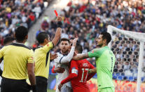 Argentina's Lionel Messi, center left, and Chile's Gary Medel, center right, scuffle as referee Mario Diaz, from Paraguay shows the red card to both of them during the Copa America third-place soccer match at the Arena Corinthians in Sao Paulo, Brazil, Saturday, July 6, 2019. (AP Photo/Victor R. Caivano)