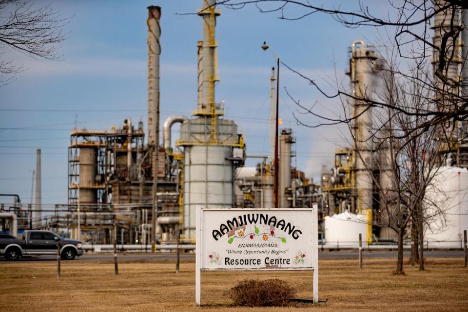 Petrochemical plants appear on the opposite side of the road, across from the Aamjiwnaang First Nation Resource Centre in southwestern Ontario, where the community has dealt with decades of air pollution.