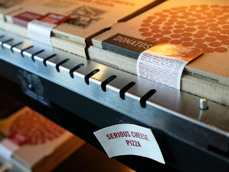 Boxes of Donatos pizza await travelers in Concourse C at John Glenn International Airport.