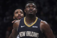 Brooklyn Nets' Mikal Bridges, left, and Pelicans' Zion Williamson look for a rebound during the first half of an NBA basketball game, Tuesday, March 19, 2024, in New York. (AP Photo/Bebeto Matthews)