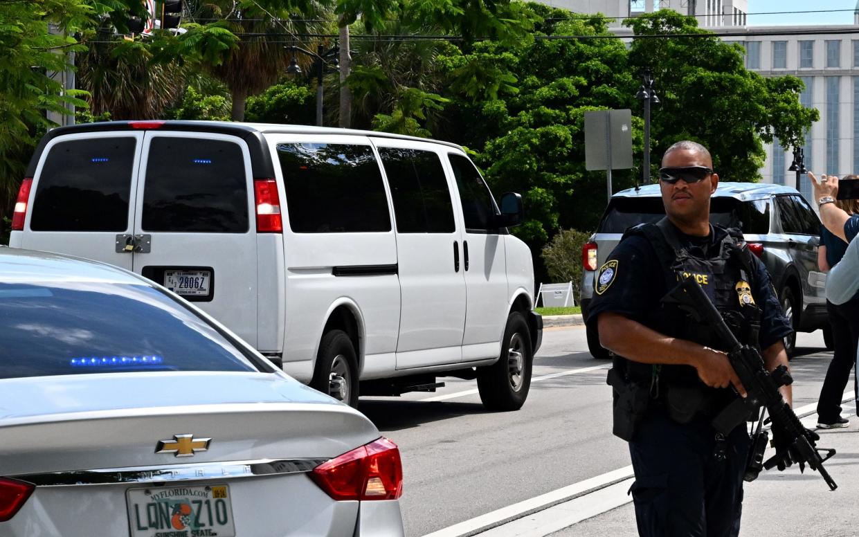 A van carrying Ryan Routh is heavily guarded by armed police