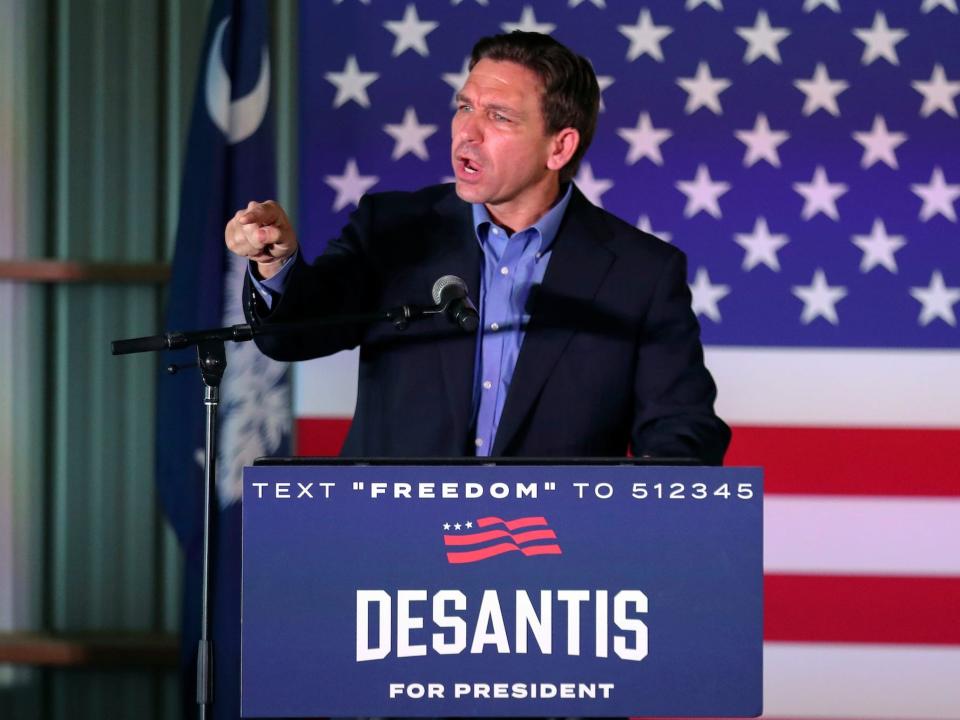 Republican presidential candidate Florida Gov. Ron DeSantis responds to a protester during a campaign event, Friday, June 2, 2023, in Lexington, South Carolina.