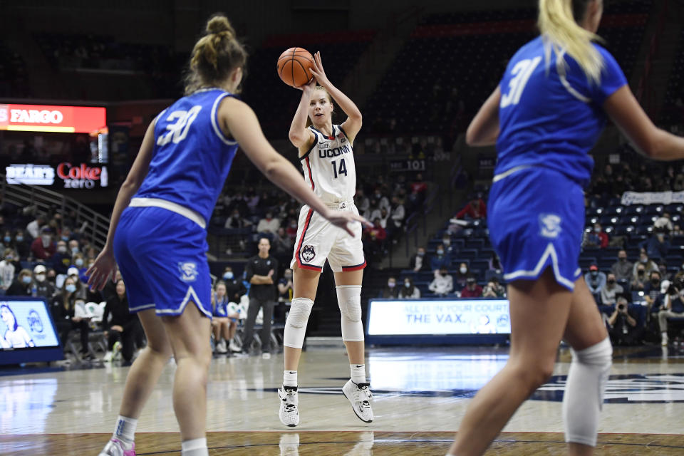 Connecticut's Dorka Juhasz (14) shoots from the 3-point area in the second half of an NCAA college basketball game against Creighton, Sunday, Jan. 9, 2022, in Storrs, Conn. (AP Photo/Jessica Hill)
