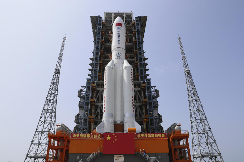 In this photo released by Xinhua News Agency, the core module of China's space station, Tianhe, on the the Long March-5B Y2 rocket is moved to the launching area of the Wenchang Spacecraft Launch Site in southern China's Hainan Province on April 23, 2021. China plans to launch the core module for its first permanent space station this week in the latest big step forward for the country’s space exploration program. The Tianhe, or “Heavenly Harmony” module is set to be hurtled into space aboard a Long March 5B rocket from the Wenchang Launch Center on the southern island of Hainan. The launch could come as early as Thursday night, April 29, 2021 if all goes as planned. (Guo Wenbin/Xinhua via AP)