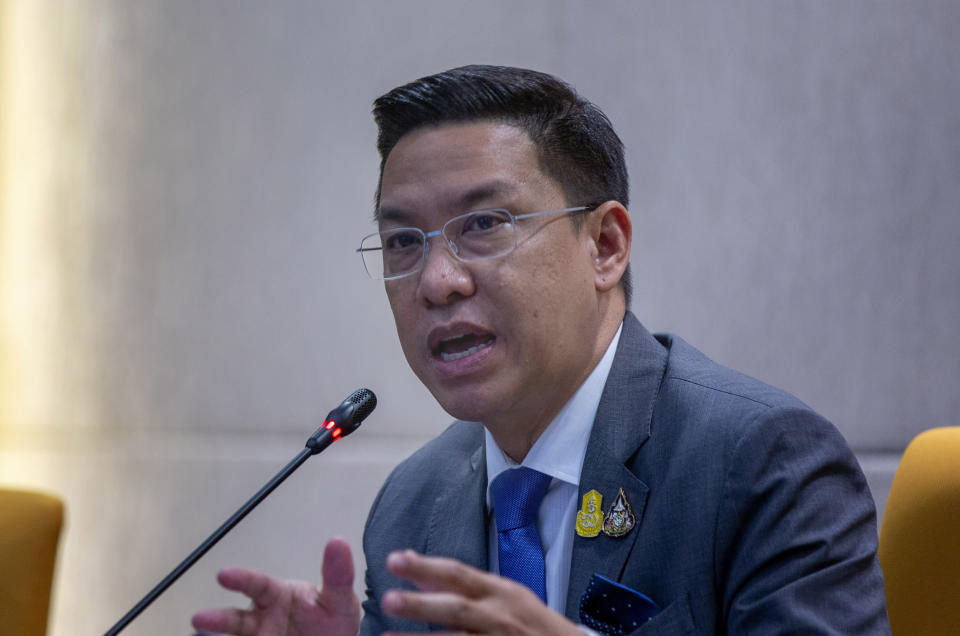 FILE - In this Wednesday, Aug. 26, 2020, file photo, Thai Minister of Digital Economy and Society Buddhipongse Punnakanta gestures during a press conference discussing the government's decision to request Facebook to block an account in Bangkok, Thailand. Buddhipongse is one of three Cabinet ministers that have been forced to leave their posts after a court found them guilty of sedition for taking part in sometimes violent protests in 2013-2014 against the government then in power. (AP Photo/Gemunu Amarasinghe,file)