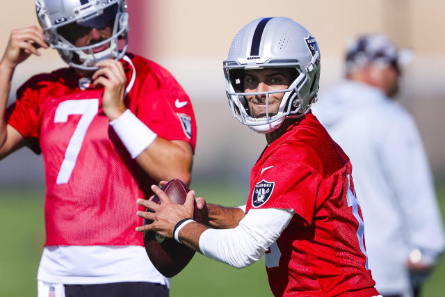 Jimmy Garoppolo, a 49ers quarterback, signs a football for a fan at their  training facility in