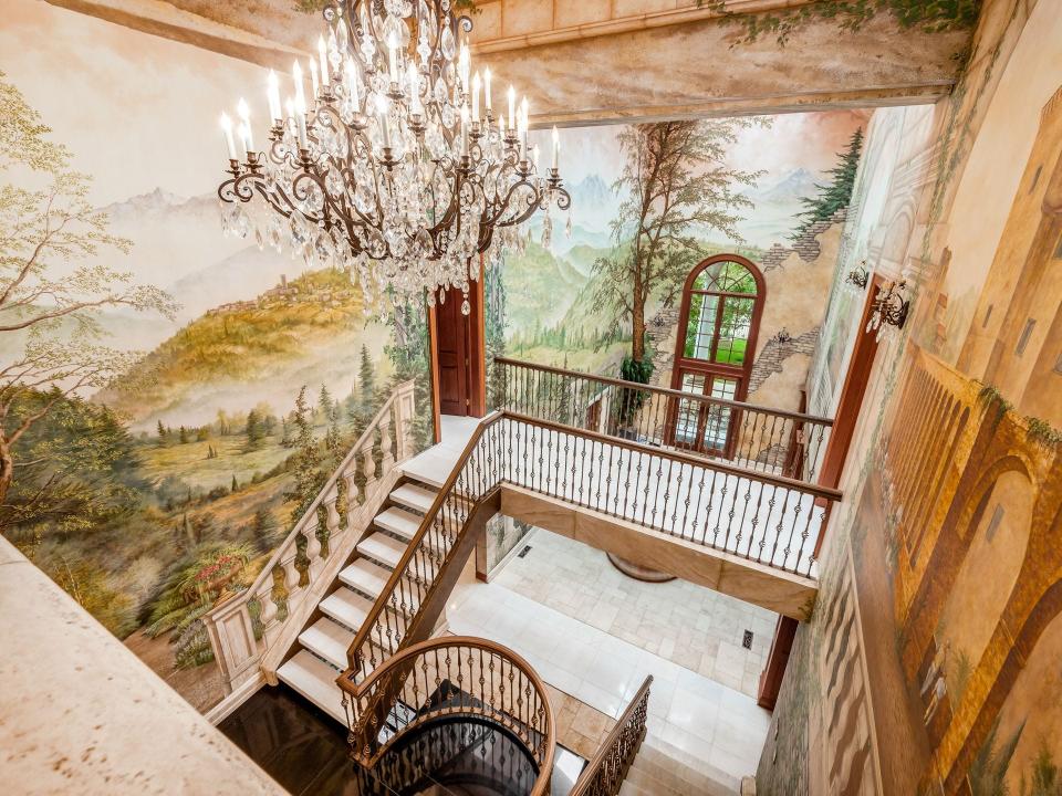 Hand-painted murals decorate several walls in the Scioto River home listed for $8 million.