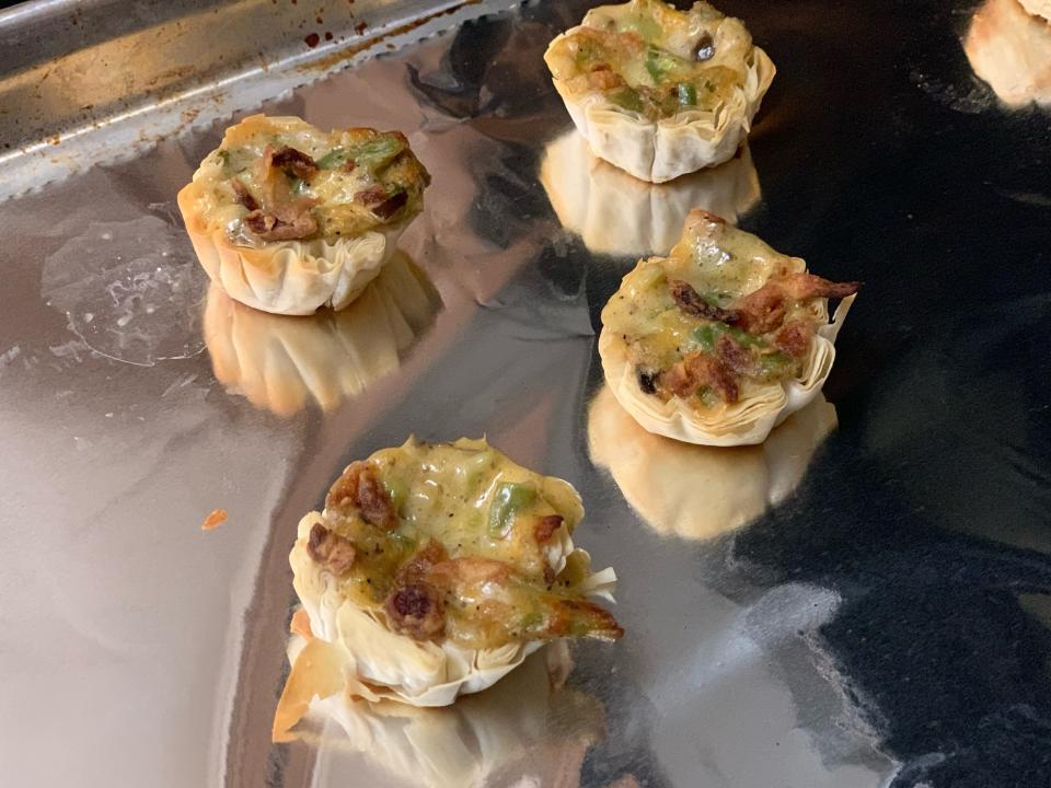 four Cooked trader joe's green bean casserole bites on baking sheet