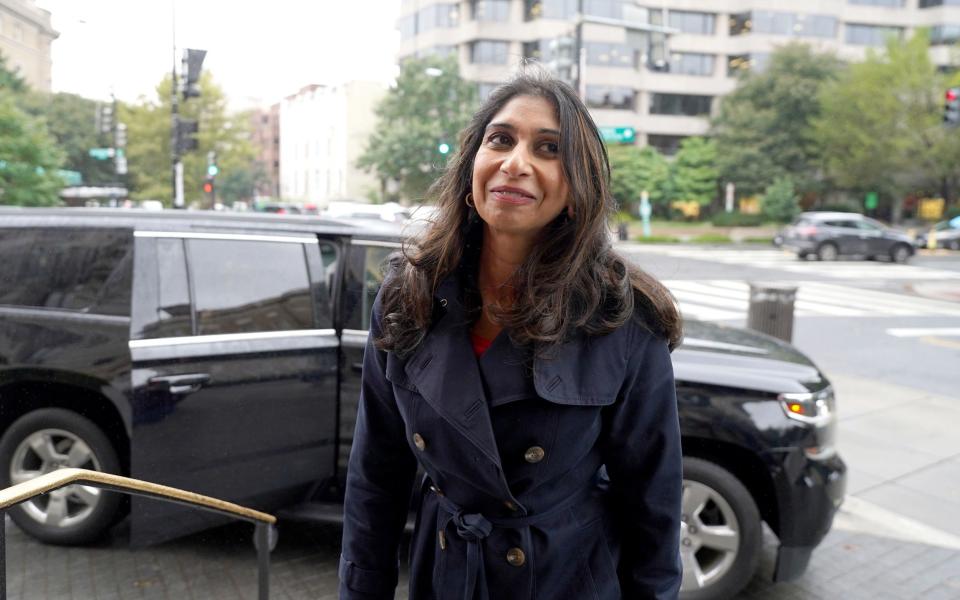 Suella Braverman, the Home Secretary, is pictured in Washington DC today