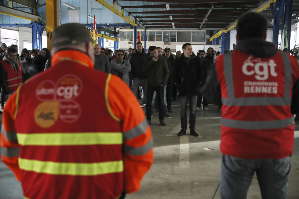 FILE - In this Dec. 9, 2019, file photo, railway workers gather during a meeting of the CGT union in Rennes, western France. Unions represent less than 10% of salaried workers but have a cozy, if paradoxical, relationship with officialdom that empowers them to block change.(AP Photo/David Vincent, File)