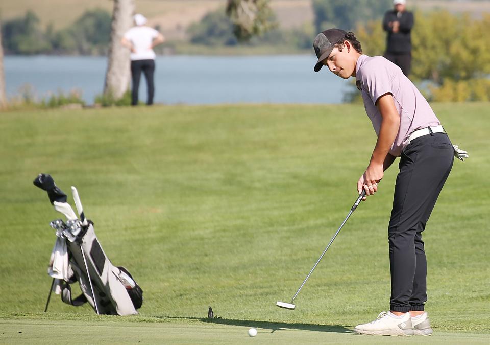 Watertown's Jaden Solheim tracks a putt during the Bill Scholten Boys Golf Invitational on Monday, Sept. 11, 2023 at the Brookings Country Club.