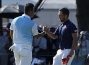 CORRECTS LAST NAME TO SCHAUFFELE FROM SHAUFFELE - Xander Schauffele of the United States, right, is congratulated by Hideki Matsuyama of Japan after winning gold in the men's golf event at the 2020 Summer Olympics on Sunday, Aug. 1, 2021, in Kawagoe, Japan. (AP Photo/Andy Wong)