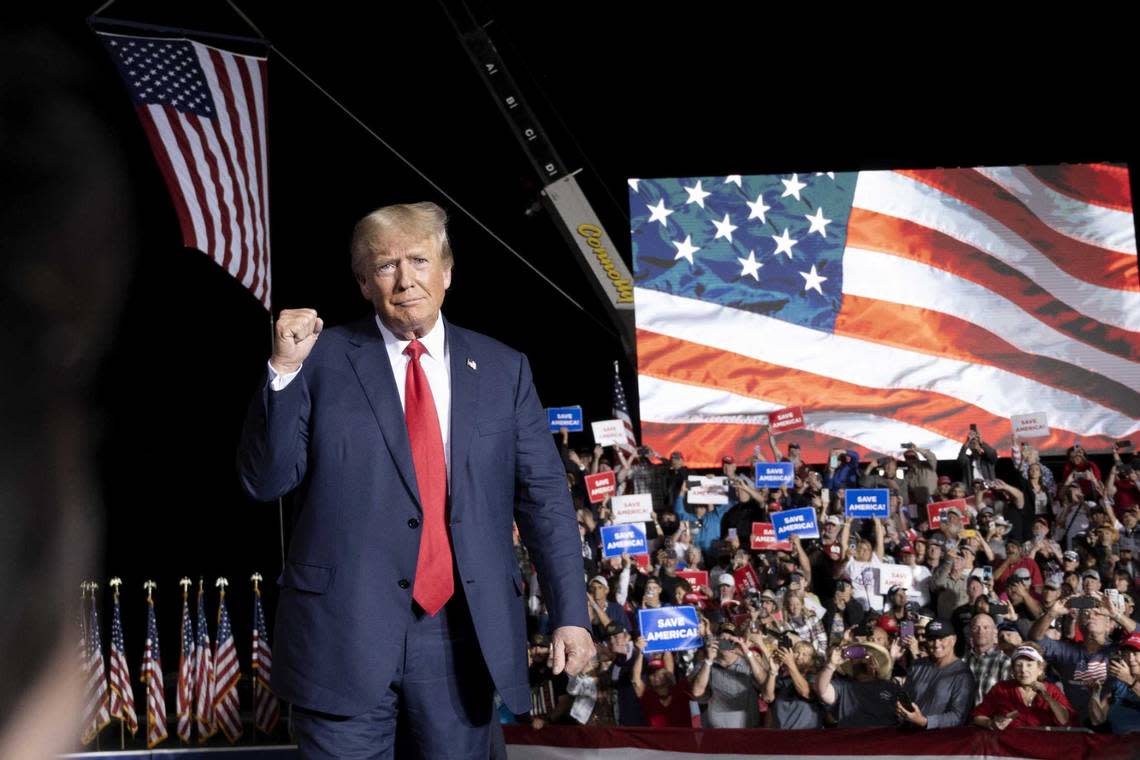 Former President Donald Trump makes his entrance at a rally Saturday at the Minden Tahoe Airport in Minden, Nev.