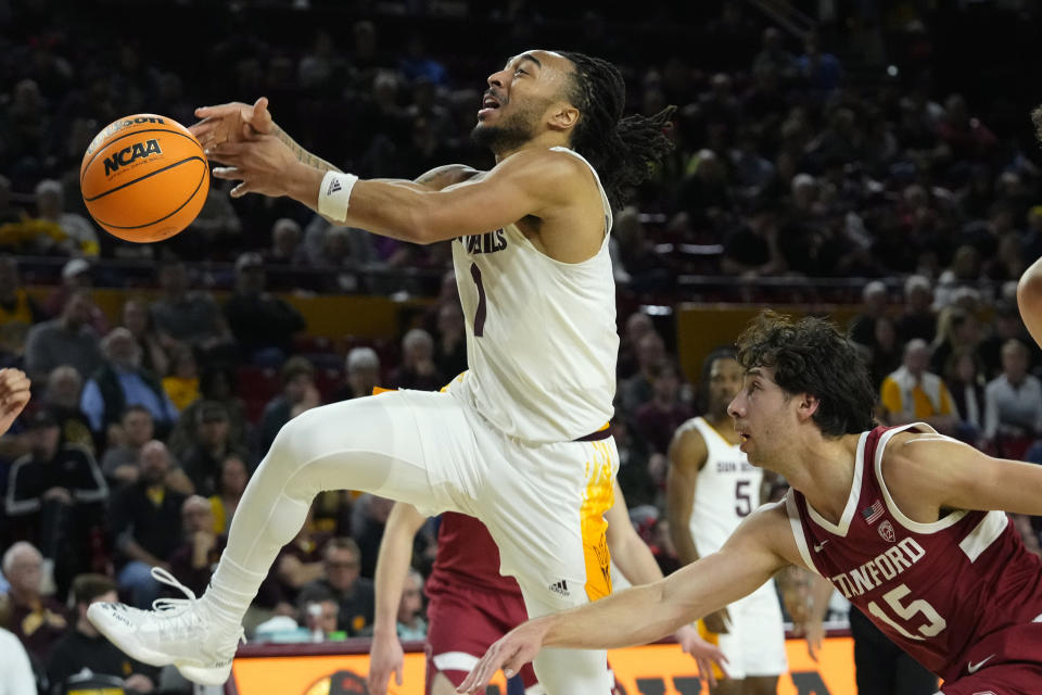 Arizona State guard Frankie Collins, left, gets the ball stripped by Stanford guard Benny Gealer (15) during the second half of an NCAA college basketball game Thursday, Feb. 1, 2024, in Tempe, Ariz. Stanford won 71-62. (AP Photo/Ross D. Franklin)