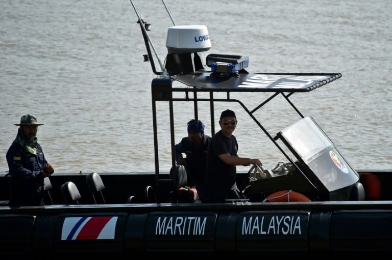 Malaysian Maritime Enforcement Agency personnel are seen return from a patrol