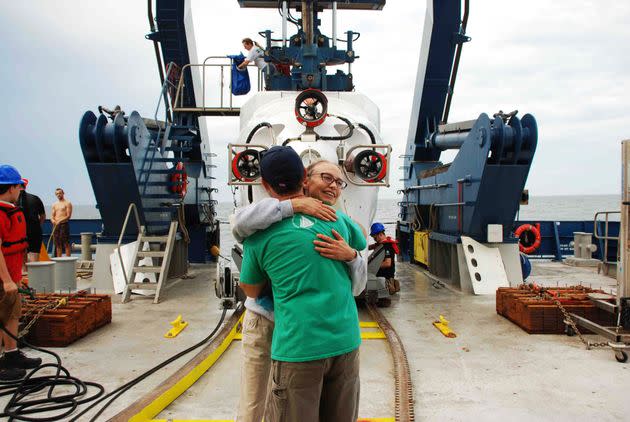 Samantha Joye and Erik Cordes hug after an Alvin dive to a methane seep in 2018.