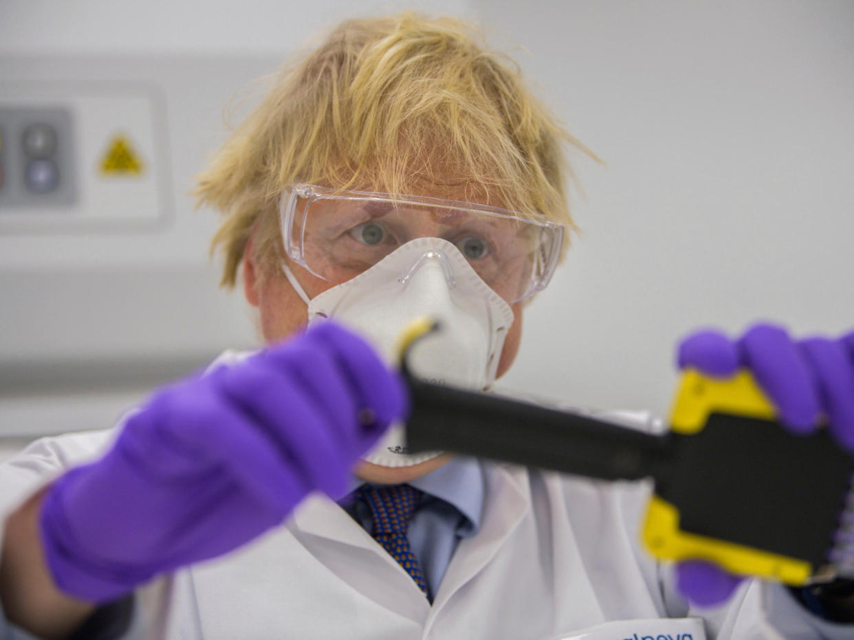 <p>Boris Johnson visited a vaccine lab in Scotland on Thursday</p> (AP)