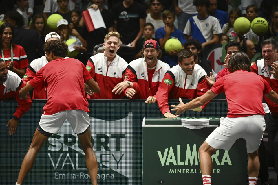 Canada's Gabriel Diallo celebrates victory against Italy's Lorenzo Musetti during the Davis Cup group stage tennis match at the Unipol Arena, Bologna, Italy, Wednesday, Sept. 13. 2023. (Massimo Paolone/PA via AP)