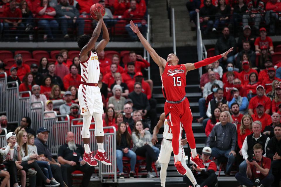 Iowa State's Izaiah Brockington (1) shoots over Texas Tech's Kevin McCullar (15) in the first half of Tuesday's game in Lubbock.