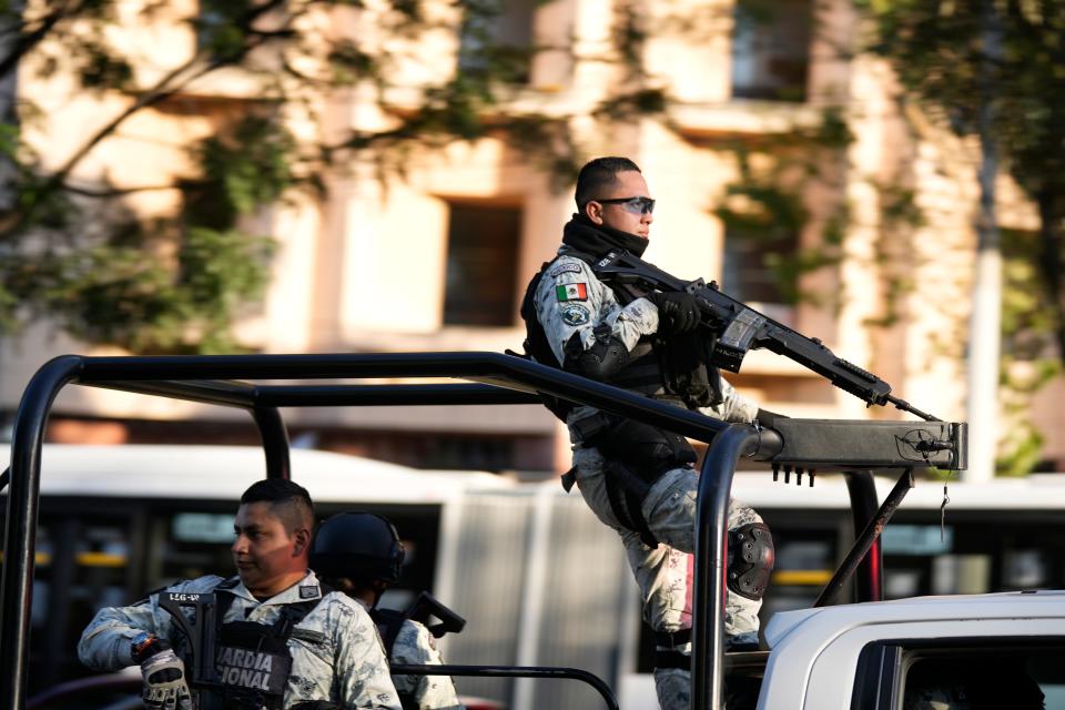 Security personnel guard the prosecutor's building where Ovidio Guzmán, one of the sons of former Sinaloa Cartel boss Joaquin "El Chapo" Guzmán, is in custody in Mexico City, Thursday, Jan. 5, 2023. The Mexican military has captured Ovidio Guzmán during an operation outside Culiacán, a stronghold of the Sinaloa drug cartel in western Mexico.