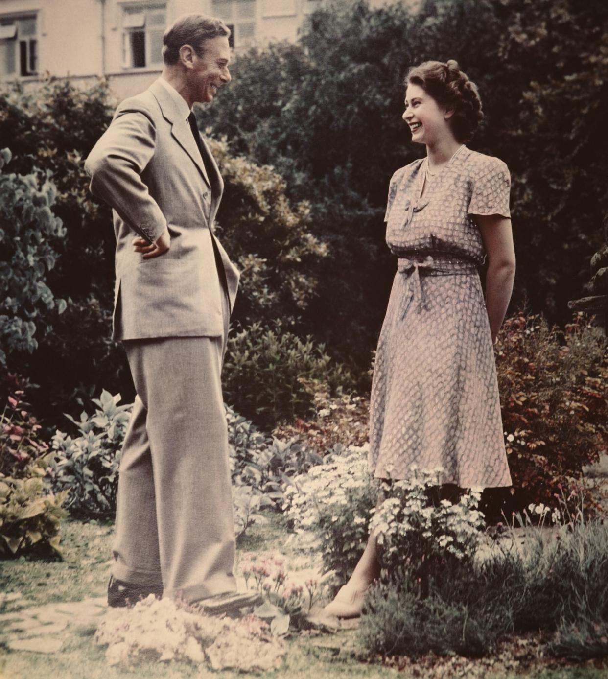 Princess Elizabeth, the future Queen Elizabeth II conversing with her father, King George VI (1895 - 1952) in a garden, 8th July 1946. (Photo by Lisa Sheridan/Studio Lisa/Hulton Archive/Getty Images)
