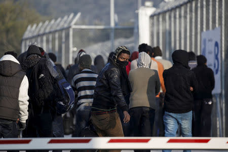 FILE PHOTO - Refugees and migrants arrive at the Moria registration centre on the Greek island of Lesbos, following a rescue operation by the Greek Coast Guard at open sea, March 21, 2016. REUTERS/Alkis Konstantinidis/File photo