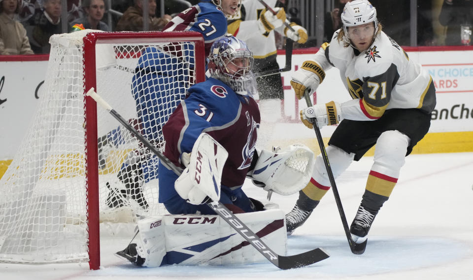 Colorado Avalanche goaltender Philipp Grubauer, left, stops a shot by Vegas Golden Knights center William Karlsson during the third period of Game 5 of an NHL hockey Stanley Cup second-round playoff series Tuesday, June 8, 2021, in Denver. (AP Photo/David Zalubowski)