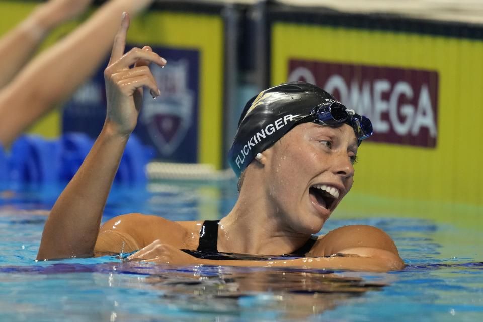 Hali Flickinger reacts after the women's 200 butterfly during wave 2 of the U.S. Olympic Swim Trials on Thursday, June 17, 2021, in Omaha, Neb. (AP Photo/Charlie Neibergall)