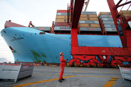 A worker is seen next to the Maersk's Triple-E giant container ship Maersk Majestic, one of the world's largest container ships, at the Yangshan Deep Water Port, part of the Shanghai Free Trade Zone, in Shanghai, China September 24, 2016. REUTERS/Aly Song