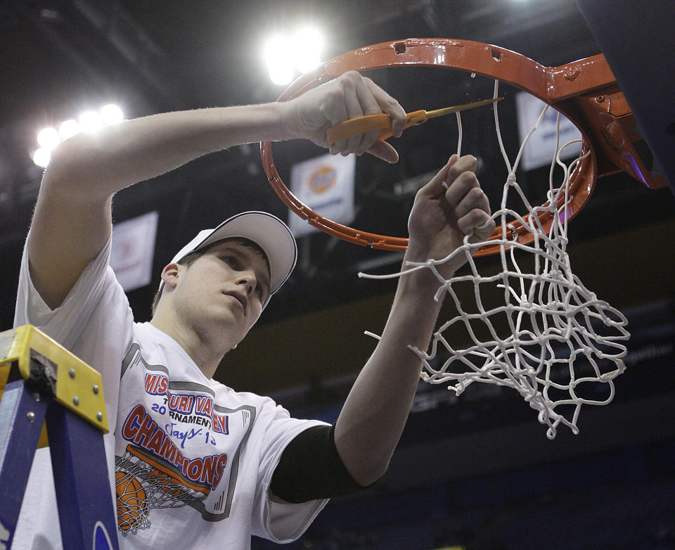 Creighton's Doug McDermott helps cut down the net after defeating Wichita State 68-65 for the Missouri Valley Conference tournament championship in an NCAA college basketball game on Sunday, March 10, 2013, in St. Louis. McDermott was named tournament Most Valuable Player. (AP Photo/Tom Gannam)