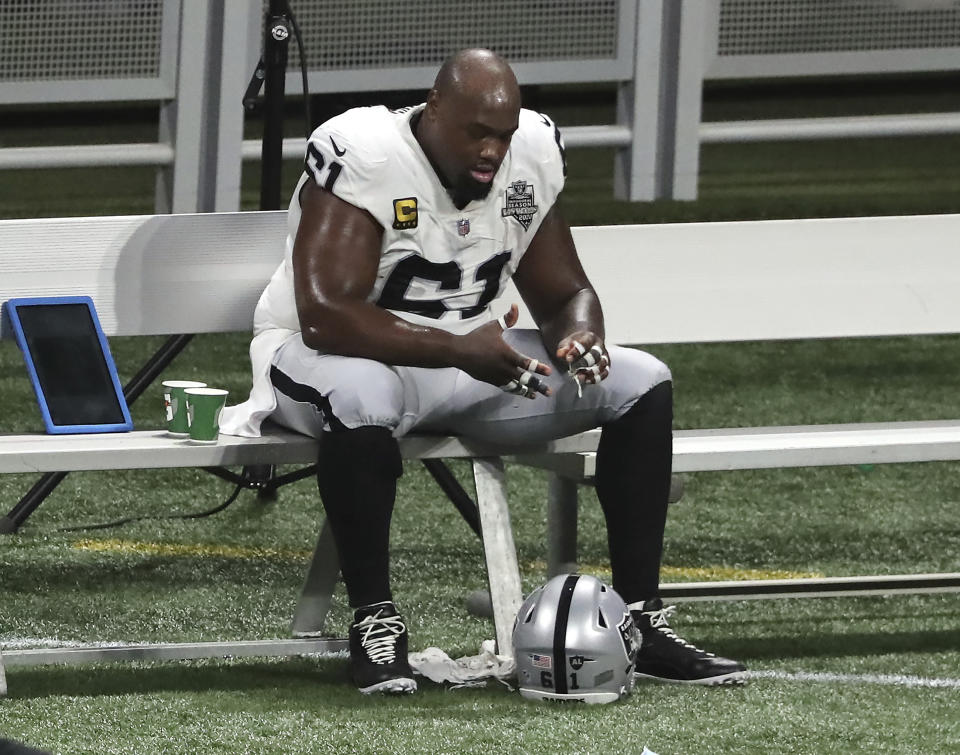 Las Vegas Raiders center Rodney Hudson sits on the bench after a loss to the Atlanta Falcons in an NFL football game on Sunday, Nov 29, 2020, in Atlanta. (Curtis Compton/Atlanta Journal-Constitution via AP)