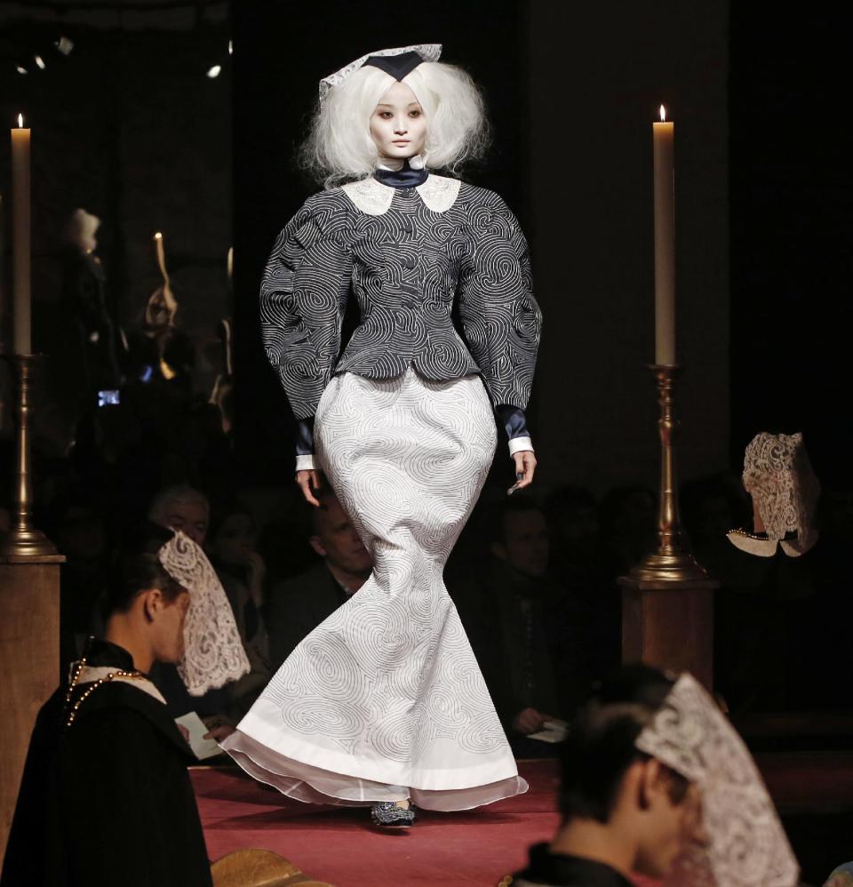 A model walks the runway during the presentation of the Thom Browne Fall 2014 collection in New York, Monday, Feb. 10, 2014. (AP Photo/Kathy Willens)