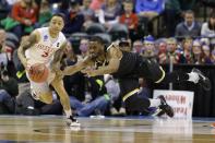 <p>Wichita State forward Rashard Kelly (0) dives to stop the steal of Dayton guard Kyle Davis (3) during the first half of a first-round game in the men’s NCAA college basketball tournament in Indianapolis, Friday, March 17, 2017. (AP Photo/Michael Conroy) </p>