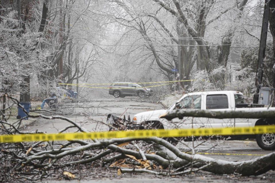 Ice storm damage blacks a road in the Westnedge Hill in Kalamazoo, Mich., on Thursday, Feb. 23, 2023. (Rodney Coleman-Robinson/MLive.com/Kalamazoo Gazette via AP)