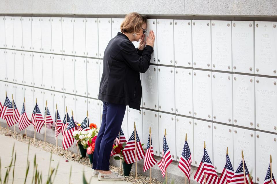 Virginia Morrow, from Long Beach, visits the remains of her husband of 48 years and retired Marine, Albert, on Memorial Day