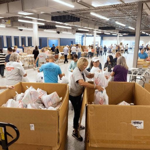 Convoy of Hope volunteers sort supplies for victims of Hurricane Ian.