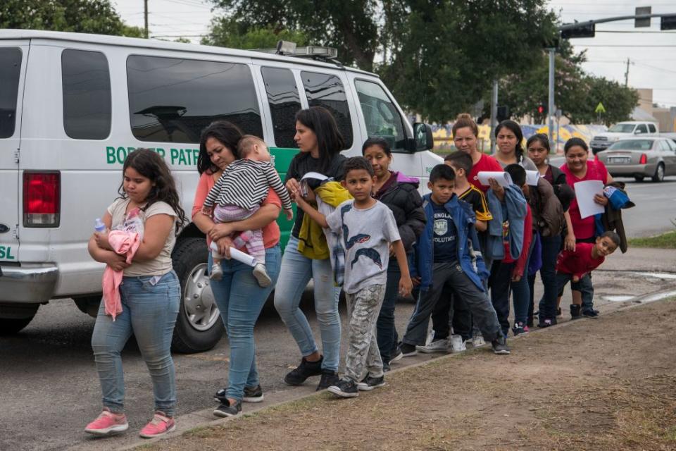 Central American migrant families arrive at a Catholic Charities respite center after being released from federal detention on June 12, 2019, in McAllen, Texas. | Loren Elliott—AFP/Getty Images