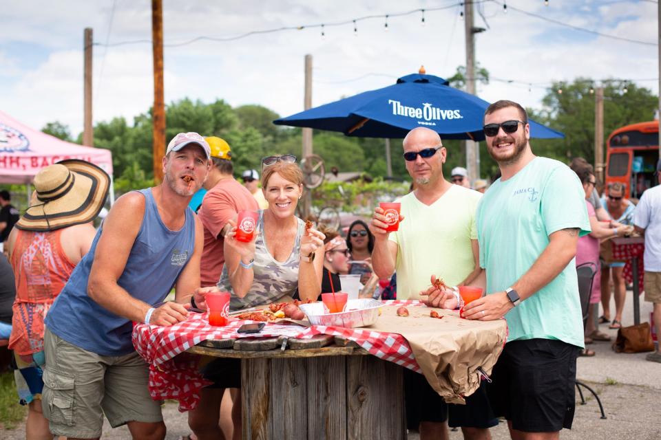 Attendees of Cajun Fest 2021 enjoy an all-you-can-eat crawfish boil and specialty drinks