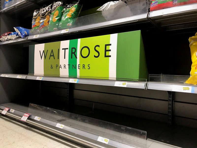 FILE PHOTO: Empty crisp shelves are pictured at Waitrose supermarket, in Canary Wharf