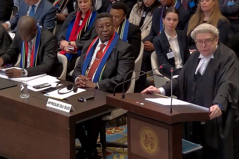 Vusimuzi Madonsela, the South African ambassador to the Netherlands (L), sits during the opening of the hearings at the International Court of Justice in The Hague, Netherlands, on Thursday. The United Nations' top court opened hearings into South Africa's allegation that Israel's war with Gaza amounts to genocide against Palestinians, a claim that Israel strongly denies. Photo by International Court of Justice