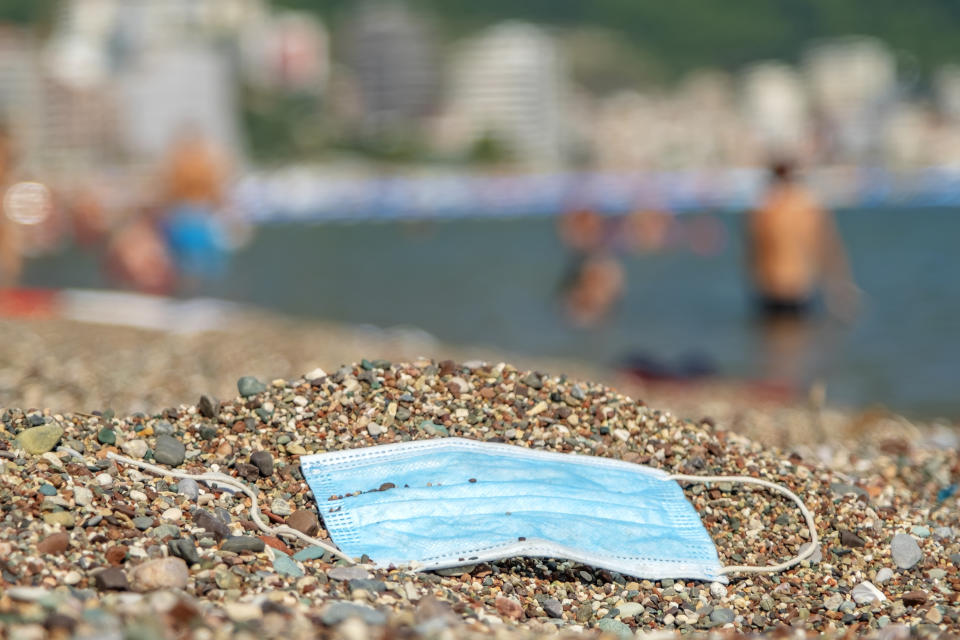 BECICI AND BUDVA, BUDVA MUNICIPALITY, MONTENEGRO - JULY 31, 2020: Discarded used face mask lies on a pebble beach. - PHOTOGRAPH BY Andrey Nekrasov / Barcroft Studios / Future Publishing (Photo credit should read Andrey Nekrasov/Barcroft Media via Getty Images)