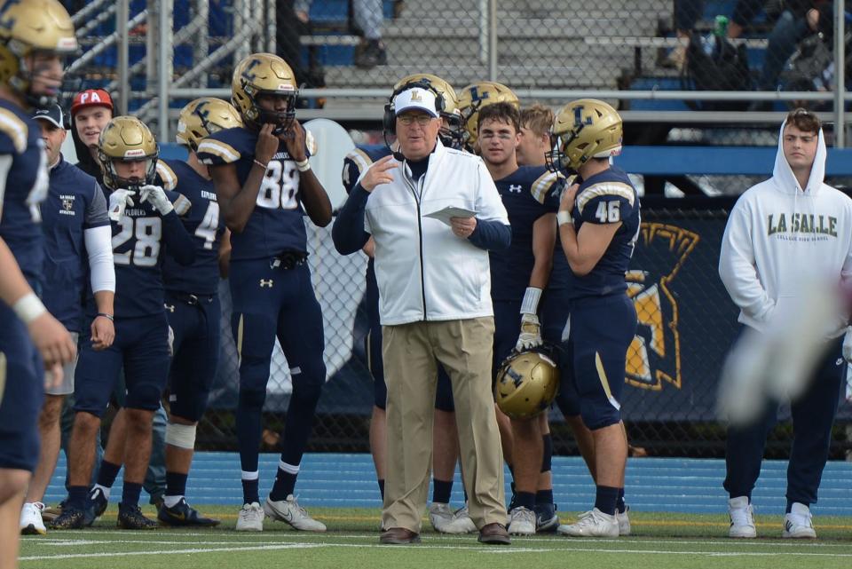 La Salle head coach John Steinmetz calls a play from the sideline during a 2021 Catholic League win over Archbishop Wood.