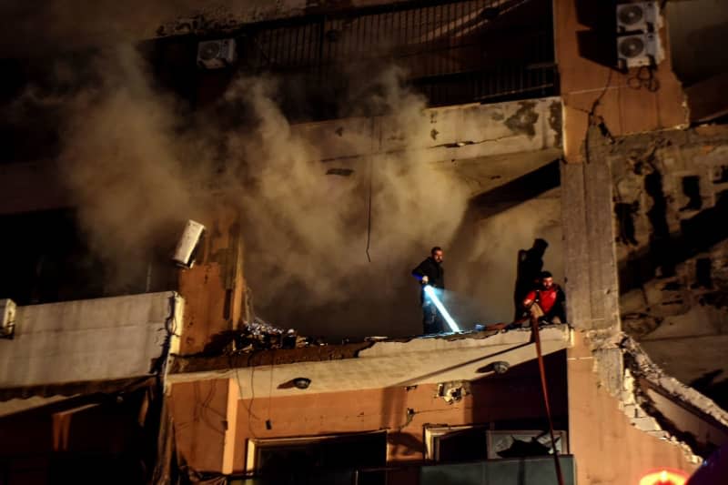 Lebanese firefighters search for survivors at a building targeted in a blast, that resulted in killing Hamas deputy leader Saleh al-Arouri an six other people. The cause was initially unclear but reports quickly began to circulate suspecting that it could have been a targeted killing on behalf of Israel. Stringer/dpa