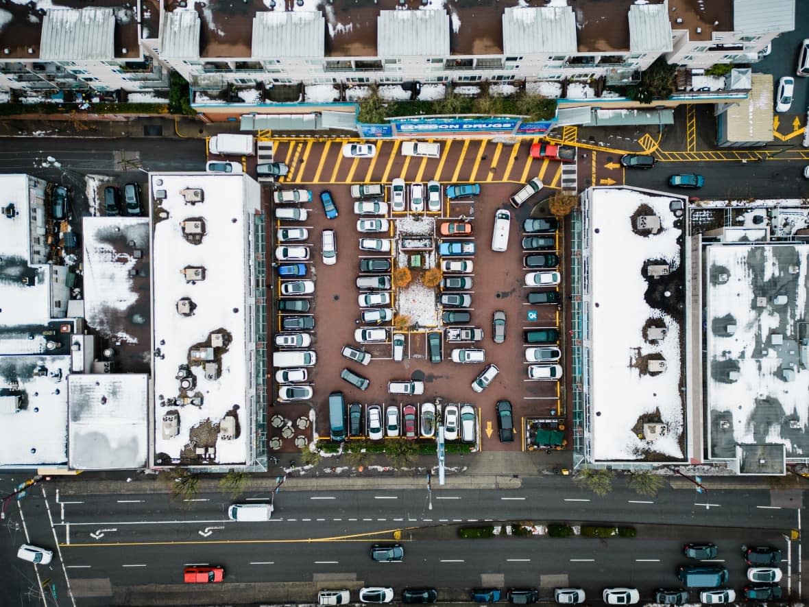 An aerial view of the parking lot at Victoria Square, at Victoria Drive and East 41st Avenue in Vancouver, B.C. (Gian Paolo Mendoza/CBC - image credit)