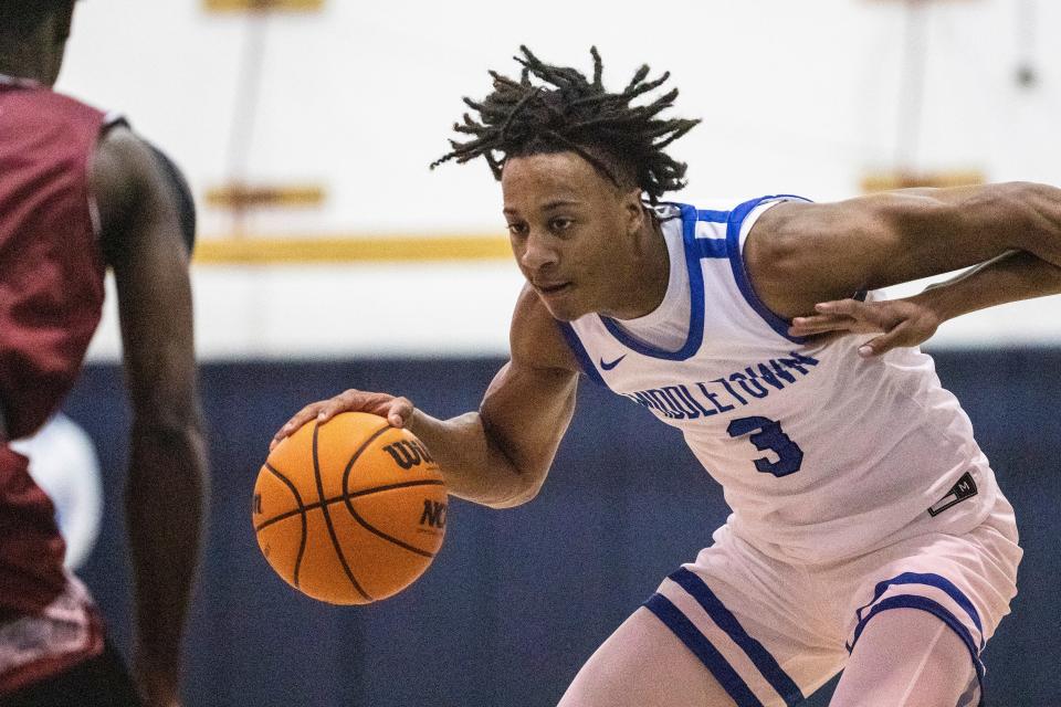 Middletown senior Marcus Edmond (3) dribbles the ball against Appoquinimink during the boys basketball game at Middletown High, Tuesday, Jan. 17, 2023. Middletown won 61-45.